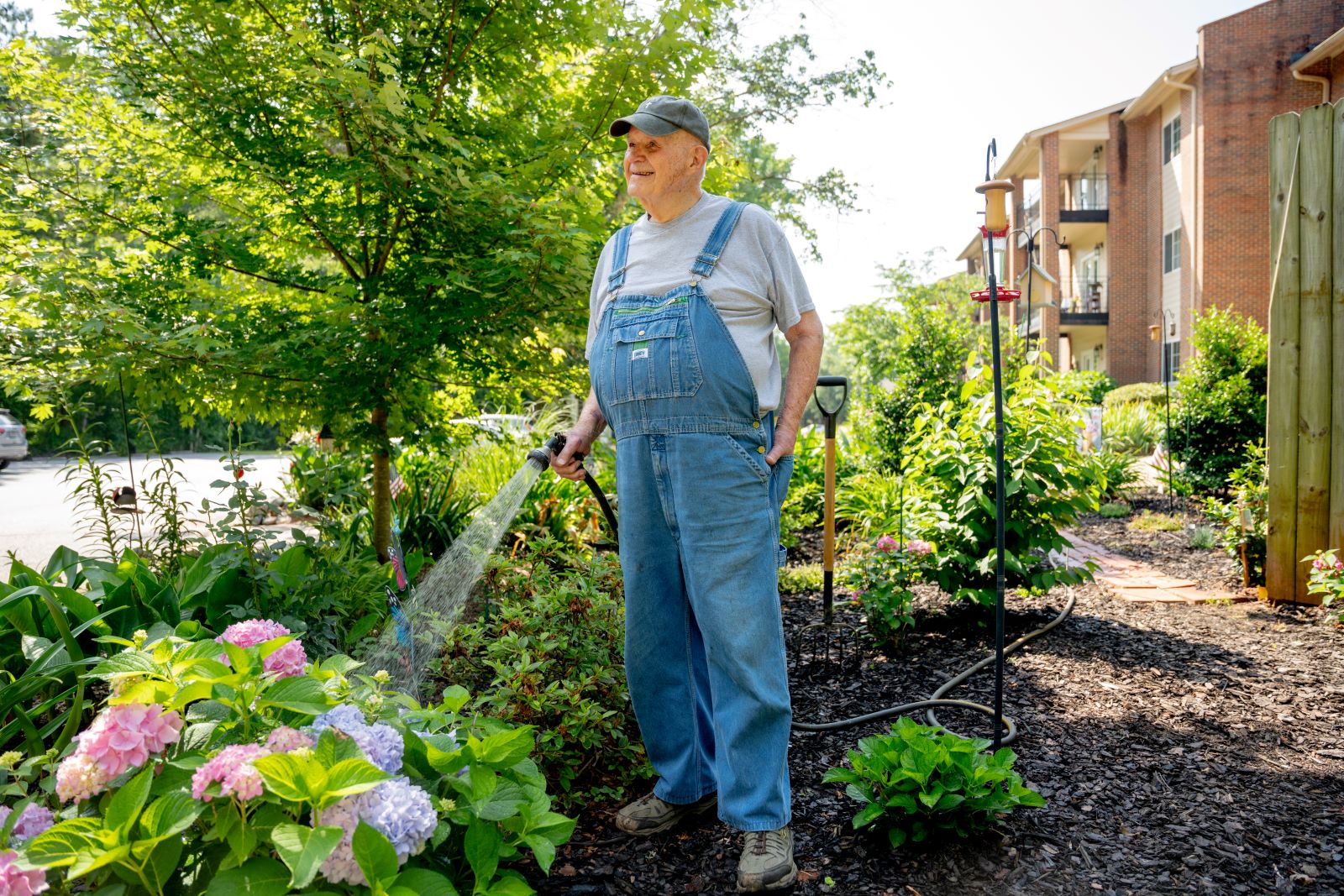 male tending to garden at Highland Hills Village