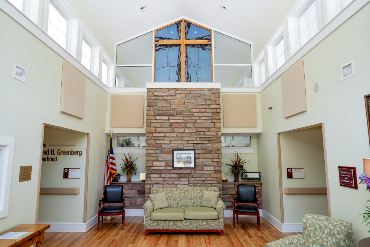 cross artwork in window of common space at Highland Hills Village