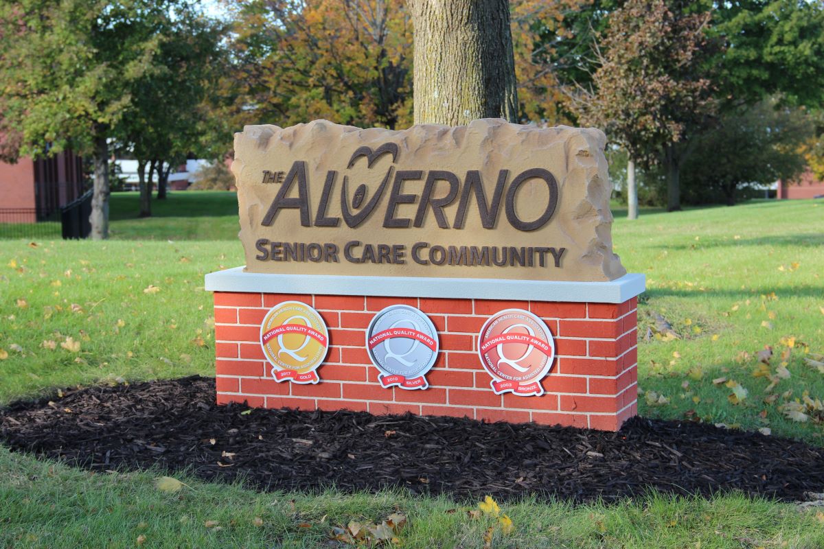 Alverno exterior sign showcasing AHCA quality award logos