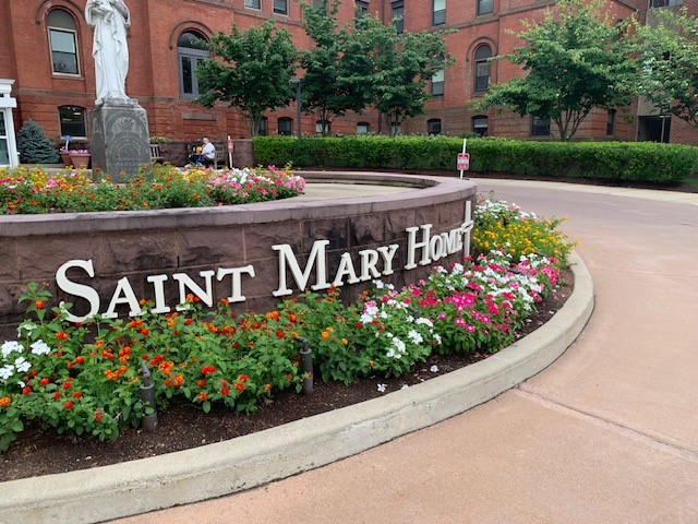 exterior of Saint Mary Home featuring spring flowers
