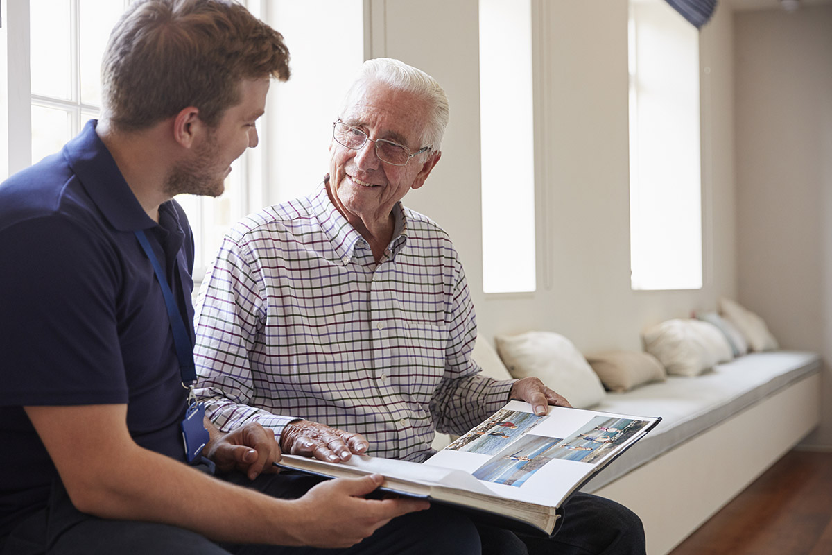 caregiver speaking with adult male